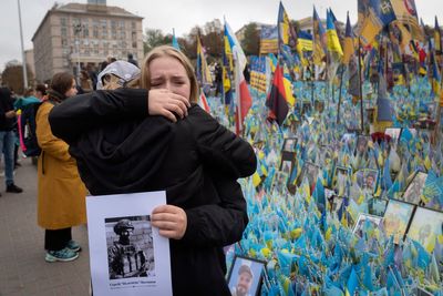 A likely Russian artillery strike kills at least 7 at a Ukrainian market