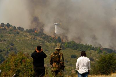 Hundreds of firefighters battle a deadly forest fire raging in southern Greece for the third day