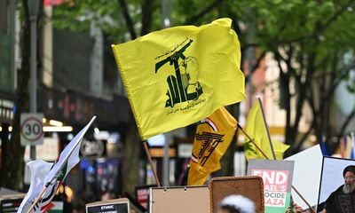 Can Australian authorities take action against protesters who wave the Hezbollah flag? Should they?