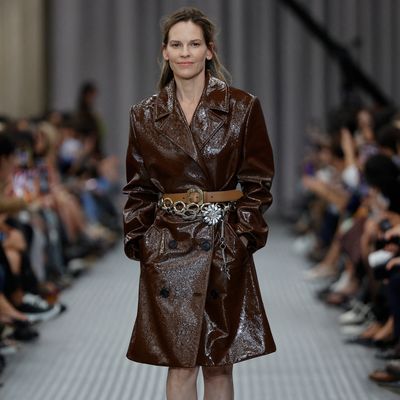 Hilary Swank's Surprise Miu Miu Runway Walk at Paris Fashion Week Features a Triple-Belted Trench Coat and Almost No Makeup