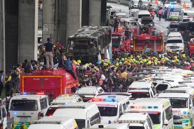 Thai police arrest driver and work to identify victims of the school bus fire that killed 23