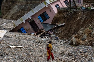 AP PHOTOS: Nepalese grapple with loss after floods kill over 200 people