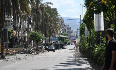 ‘We will resist’: defiance amid destruction in Beirut’s deserted suburbs