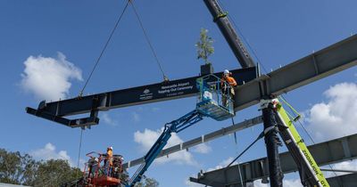 Watch final roof beam lifted onto Newcastle Airport international terminal