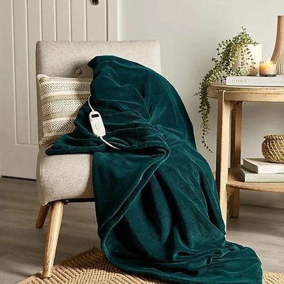 I've tested both electric blankets and heated throws and these are the key differences you need to know before investing in one