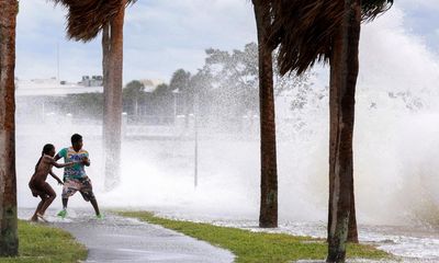 Florida man rescues neighbors on surfboard after Helene floods island city