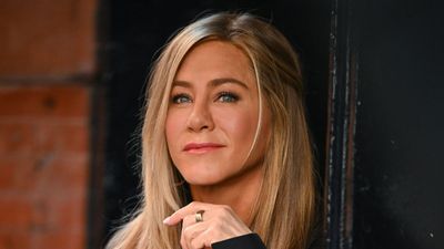 Jennifer Aniston's home bar combines dark wood and gold accents for a lesson in understated luxury – designers say it's a 'statement of sophistication'