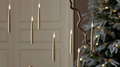 How to hang floating candles for a magical touch – party planning pros love how it brings 'atmosphere and mood' to your fall and Halloween decor