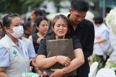 Small town in Thailand hold mass cremation for 23 who died in a school trip bus fire