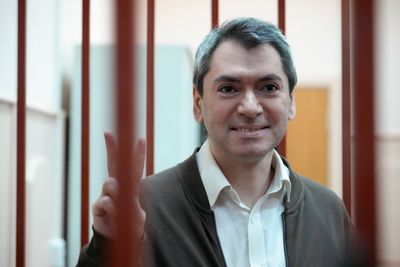 Jailed leader of a prominent election watchdog is on trial in Russia