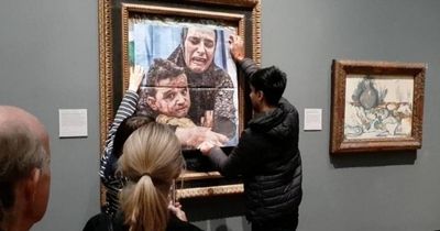 Protesters paste image of Palestinian mother and child over Picasso painting