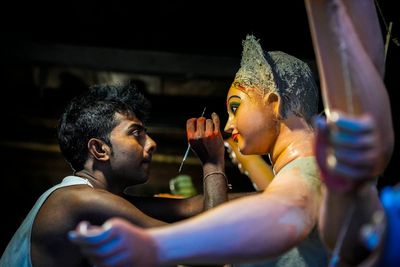 AP PHOTOS: Artisans in India’s Assam state make colorful mud idols of Hindu gods for Durga Puja