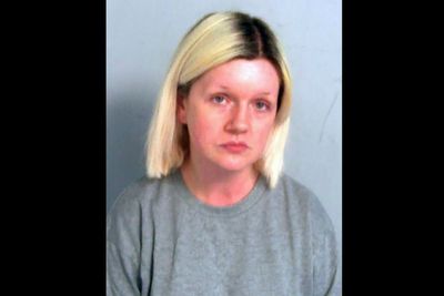 British woman who killed her parents and lived with their bodies is sentenced to life