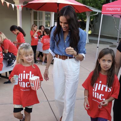 Meghan Markle Is the Equestrian-Prep Ideal in a J.Crew Shirt and White Pants