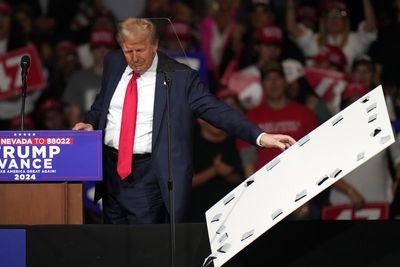 Trump, after mocking Harris over teleprompter use, stops rally to remove sign that fell on his