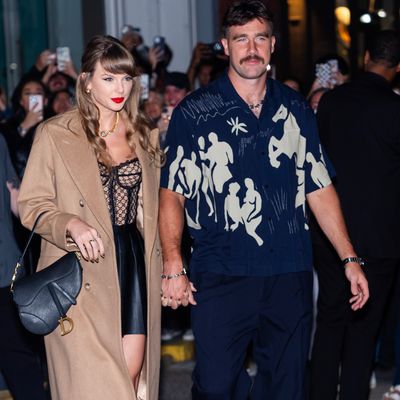 Taylor Swift's Lace Gucci Corset Spices Up a Classic Camel Coat for a New York City Date Night