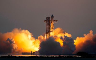 In an engineering feat, mechanical SpaceX arms catch Starship rocket booster at landing pad