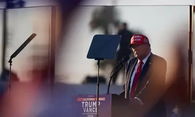 Man arrested near Donald Trump’s California rally with loaded guns, police say