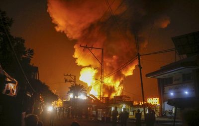 Israeli strike on Gaza hospital tent camp kills four and ignites a fire that burns dozens