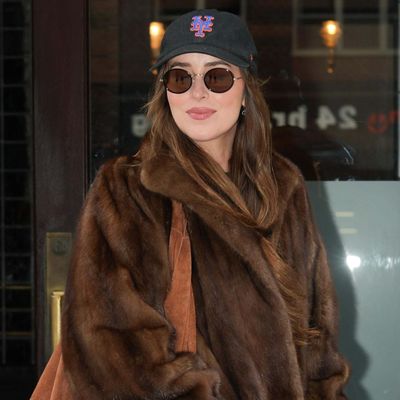 Dakota Johnson Matches the Suede Bag Trend to a Mob Wife-Worthy Fur Jacket