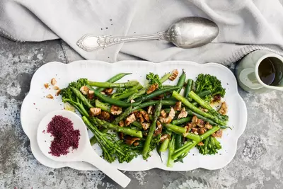 Steamed brocolini and asparagus with candied pecans