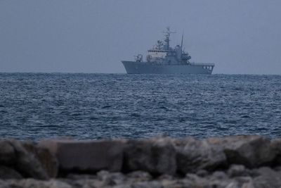 First Italian ship with 16 intercepted migrants docks at Albanian port to process asylum request