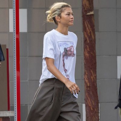 Zendaya Flexes Her Rare Vintage T-Shirt in Boyish Baggy Trousers and White Sneakers