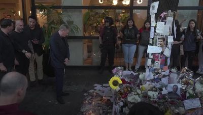 Liam Payne's father reads tributes and kisses pictures outside Argentinian hotel where One Direction star died