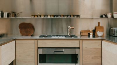 Want to Make Your Cool Chrome and Stainless Steel Accents Feel Warmer This Fall? Add Wood