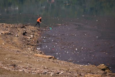 Residents and activists in central Bosnia clean up a lake after massive floods