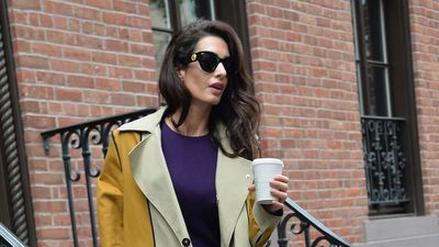 Amal Clooney's two-tone yellow trench coat and royal purple midi dress is the unexpectedly beautiful colour combination we're adding to our wardrobes this season