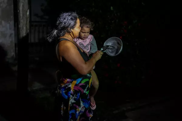 Cubans struggle with an extended power outage and a new tropical storm