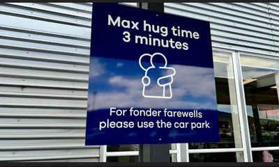 New Zealand airport causes stir with sign capping goodbye cuddles to 3 minutes