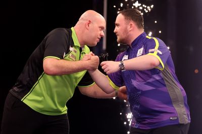 Michael van Gerwen jokingly strangles Luke Littler after record-breaking defeat