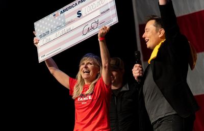 Conspiracy theories and a $1m check: a night at Elon Musk’s surreal election giveaway