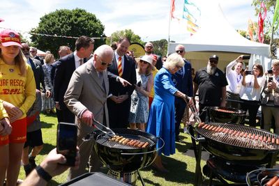 Charles and Camilla take charge of the tongs at Sydney ‘sausage sizzle’ barbeque