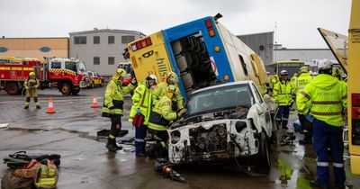 Firefighters confront bus collision, casualties in realistic scenario