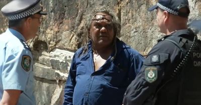 'Not my king': Police arrest Aboriginal activist for anti-monarchy protest in Sydney