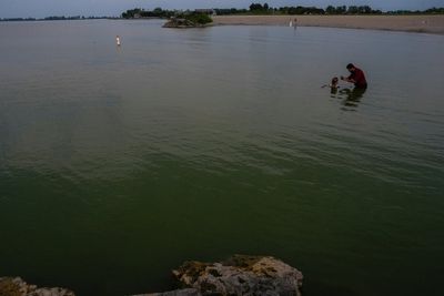 Researchers in a lab near Lake Erie study how toxic algae can damage health