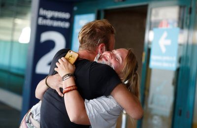 New Zealand airport introduces 'cuddle cap' to cut down on long goodbyes