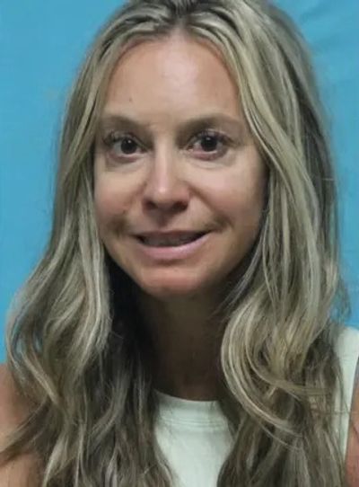 Texas Middle School Teach Smiles in Mug Shot After Arrest for Alleged Sex Assault of Former Student