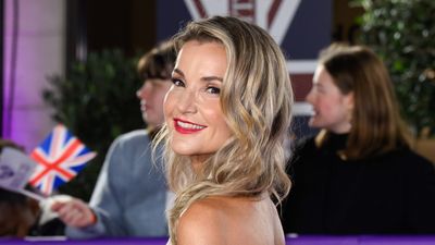 Helen Skelton was a vision in metallic silver as she teamed a flowing tie-back gown with bold fuchsia lips for an impeccable red carpet moment