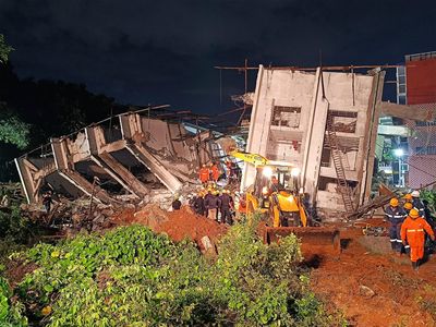 Building collapses during heavy rains in southern India city, killing at least 5 workers