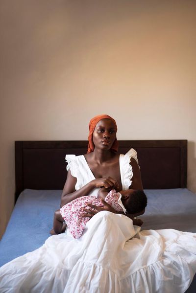 An isolated mother breastfeeding her child during Covid: Dola Posh’s best photograph