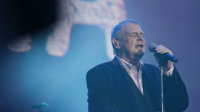 “My facial disfigurement from the surgery means I can’t open my mouth wide enough for a strip of spaghetti, let alone to sing”: John Farnham on why his voice is now silenced