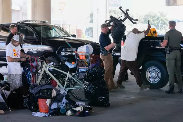 Before Taylor Swift show in New Orleans, a homeless encampment is forced to move