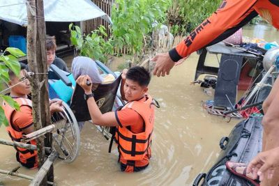 Tropical storm battering Philippines leaves at least 23 people dead in flooding and landslides