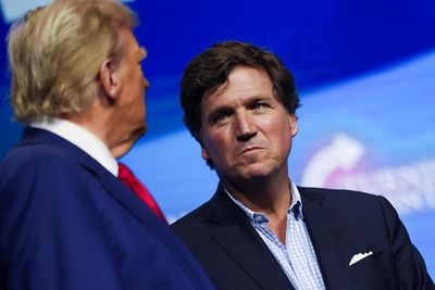 Tucker Carlson warms up crowd at Trump rally with bizarre spanking rant