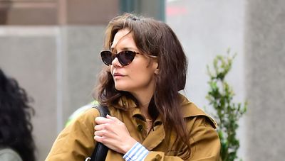 We're taking styling tips from Katie Holmes on how to wear a trench coat - paired with light denim jeans, a patterned shirt, and leather loafers