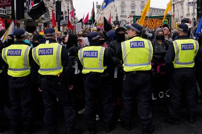 Supporters of far-right British figure rally as anti-racism demonstrators mount counter-protest